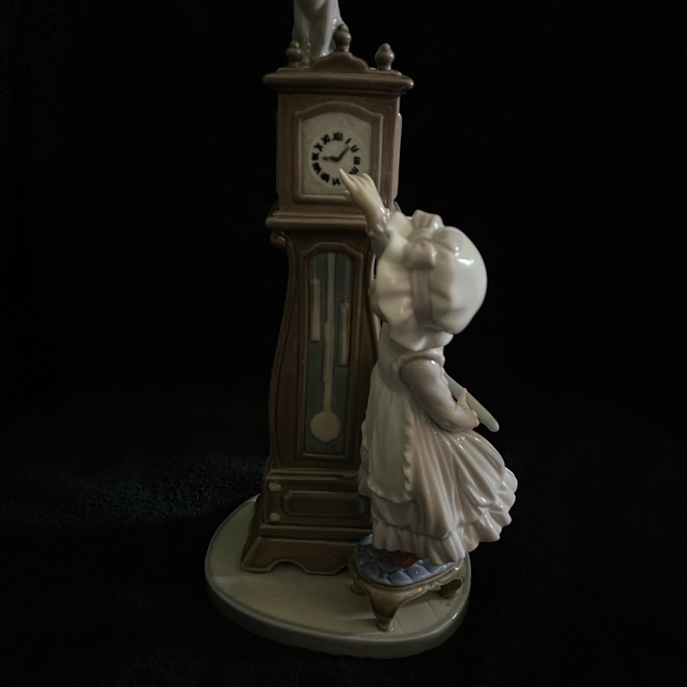 Lladro Porcelain Girl Reaching Grandfather Clock Figurine in Cream and Tan